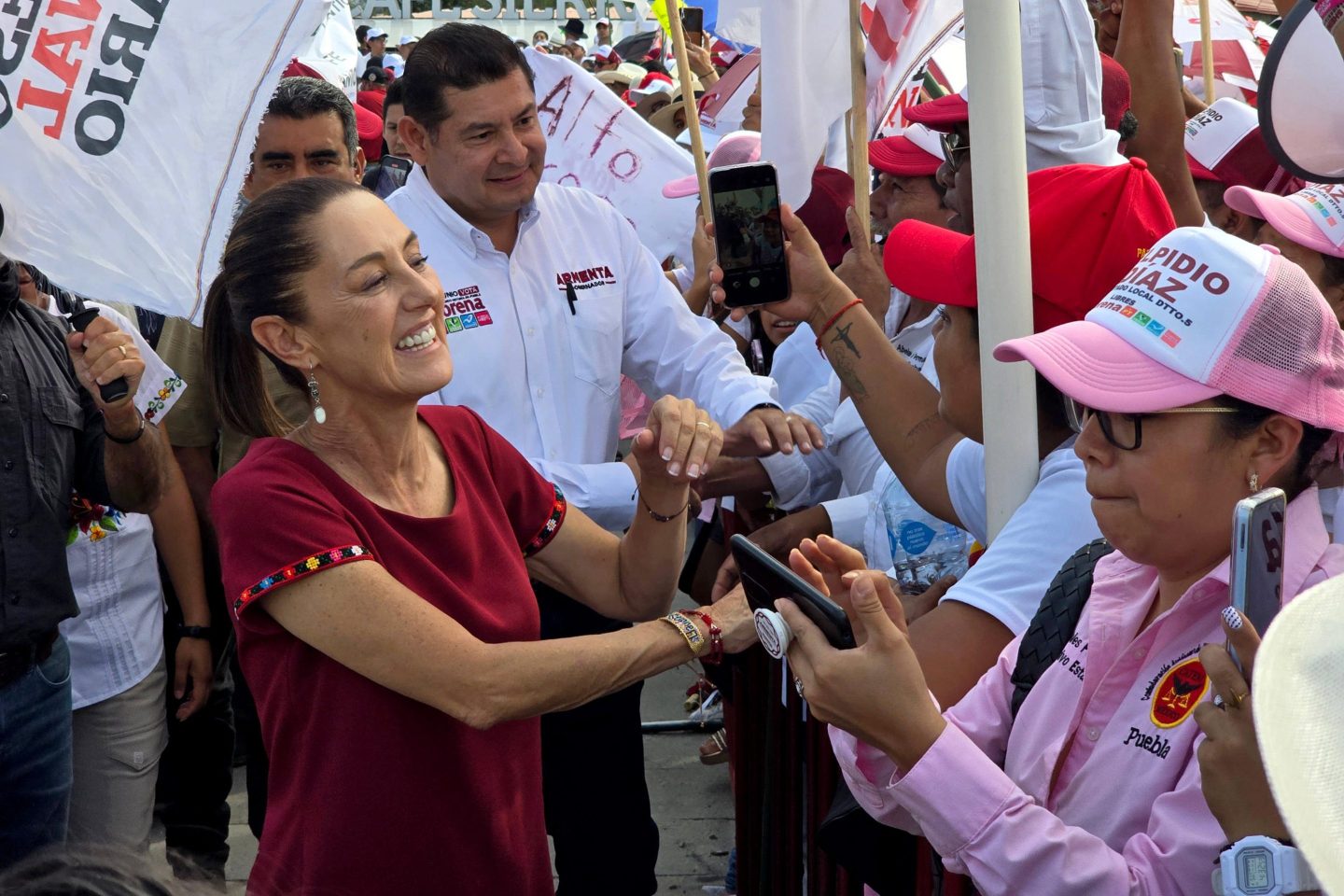 Leading presidential candidate Claudia Sheinbaum of the "Sigamos Haciendo Historia" coalition greets her supporters during a rally on May 25, 2024 in Puebla, Mexico.