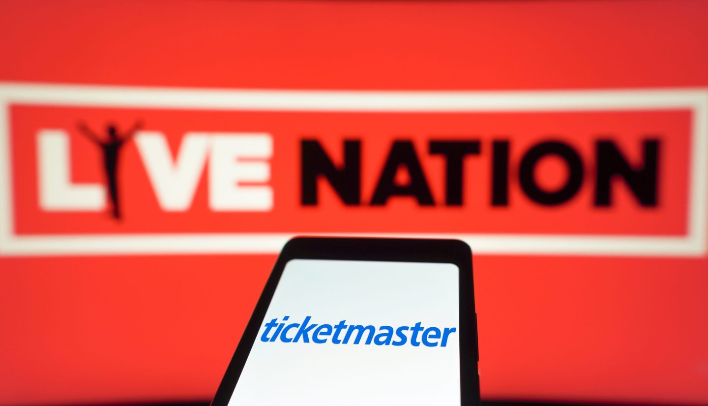 Ticketmaster logo is displayed on a smartphone