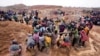 Miners work at an illegal tin mining site in Jos, Nigeria, April 3, 2024. 