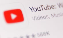 Close-up shot of the YouTube logo on a screen