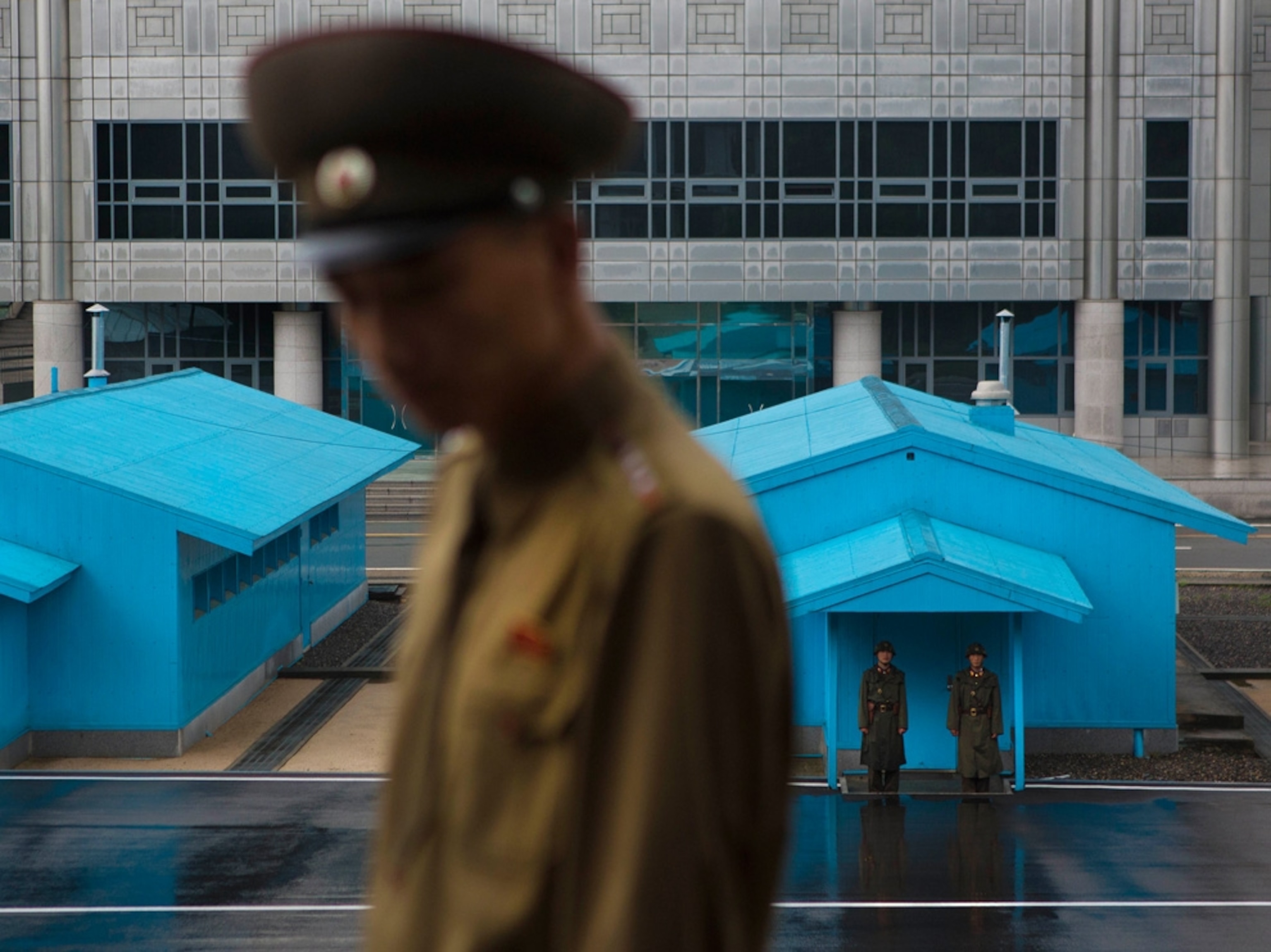 North Korean soldiers standing guard in front of the truce village of Panmunjom