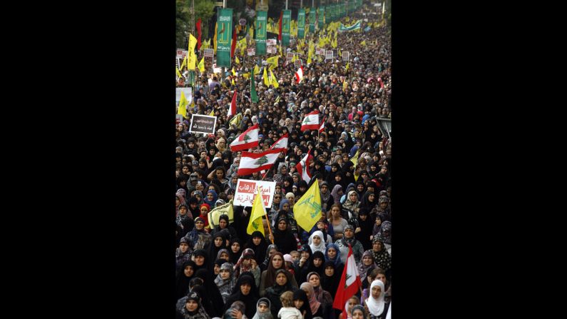 Supporters of Lebanon's Hezbollah group march during a rally in southern Beirut to denounce the film mocking Islam on Monday, September 17. Hezbollah chief Hassan Nasrallah, who made a rare public appearance at the rally, has called for a week of protests across the country over the film, describing it as the 