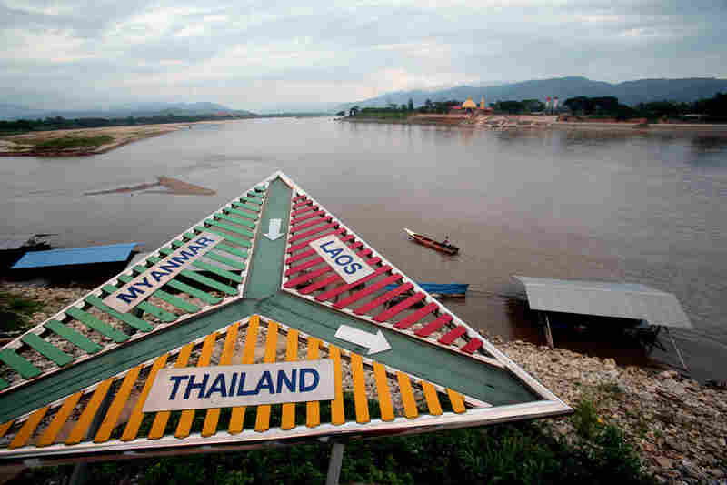 Signs in Sop Ruak, Thailand, point the directions to three of the countries that make up the notorious drug-producing and trafficking area along the Mekong River known as the Golden Triangle.