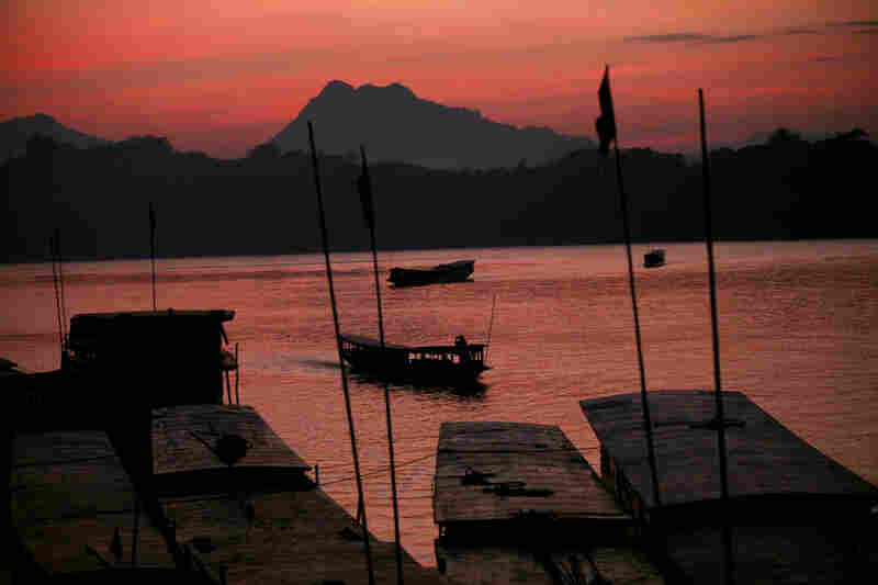 The sun sets over the Mekong in Luang Prabang.