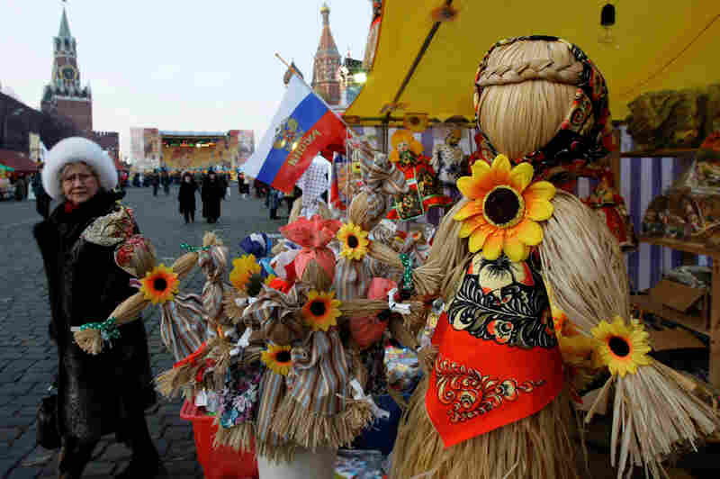 People view straw effigies for sale at a booth just outside the Kremlin in 2009. Often referred to as "Lady Maslenitsa," the straw figures are meant to symbolize winter (the word for winter in Russian is feminine).