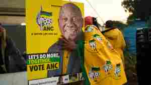 African National Congress (ANC) polling agents set up a tent decorated with party paraphernalia outside a polling station in Umlazi on May 29 during South Africa's general election.
