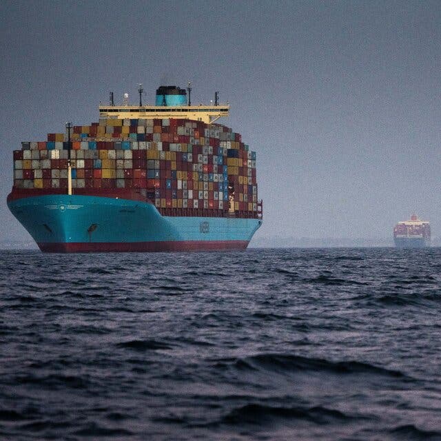 Four container ships in the sea wait to enter the Port of Los Angeles.