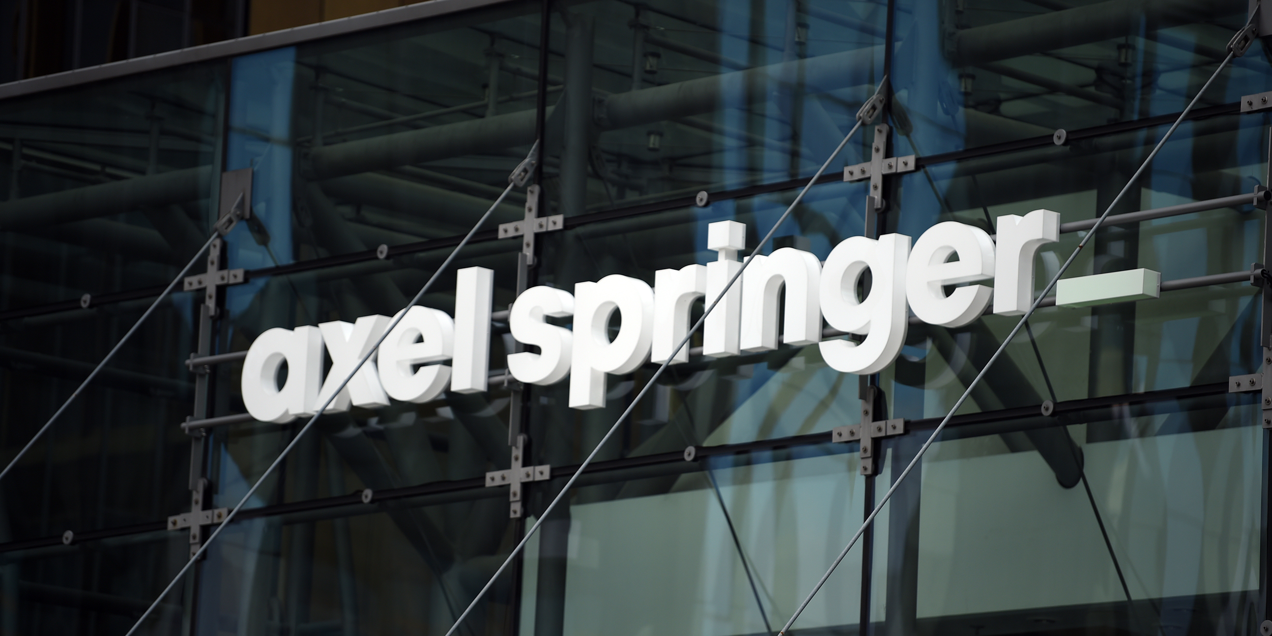 06 May 2019, Berlin: The lettering "Axel Springer" at the entrance of the Axel Springer skyscraper. (to "Axel Springer - 1st Quarter") Photo: Sven Braun/dpa (Photo by Sven Braun/picture alliance via Getty Images)